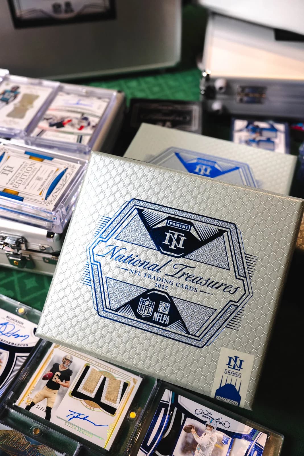 National Treasures boxes and premium cards arranged at the Zilla Breaks table